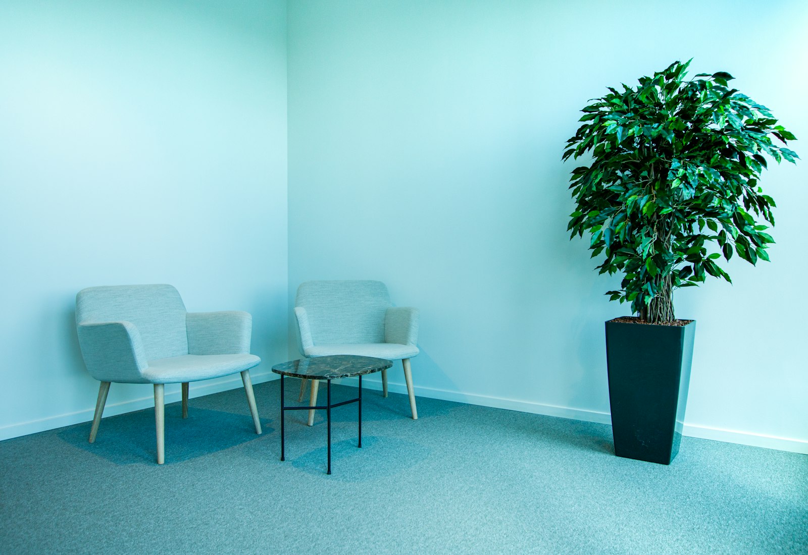 A private consultation room with two chairs (placeholder photography)